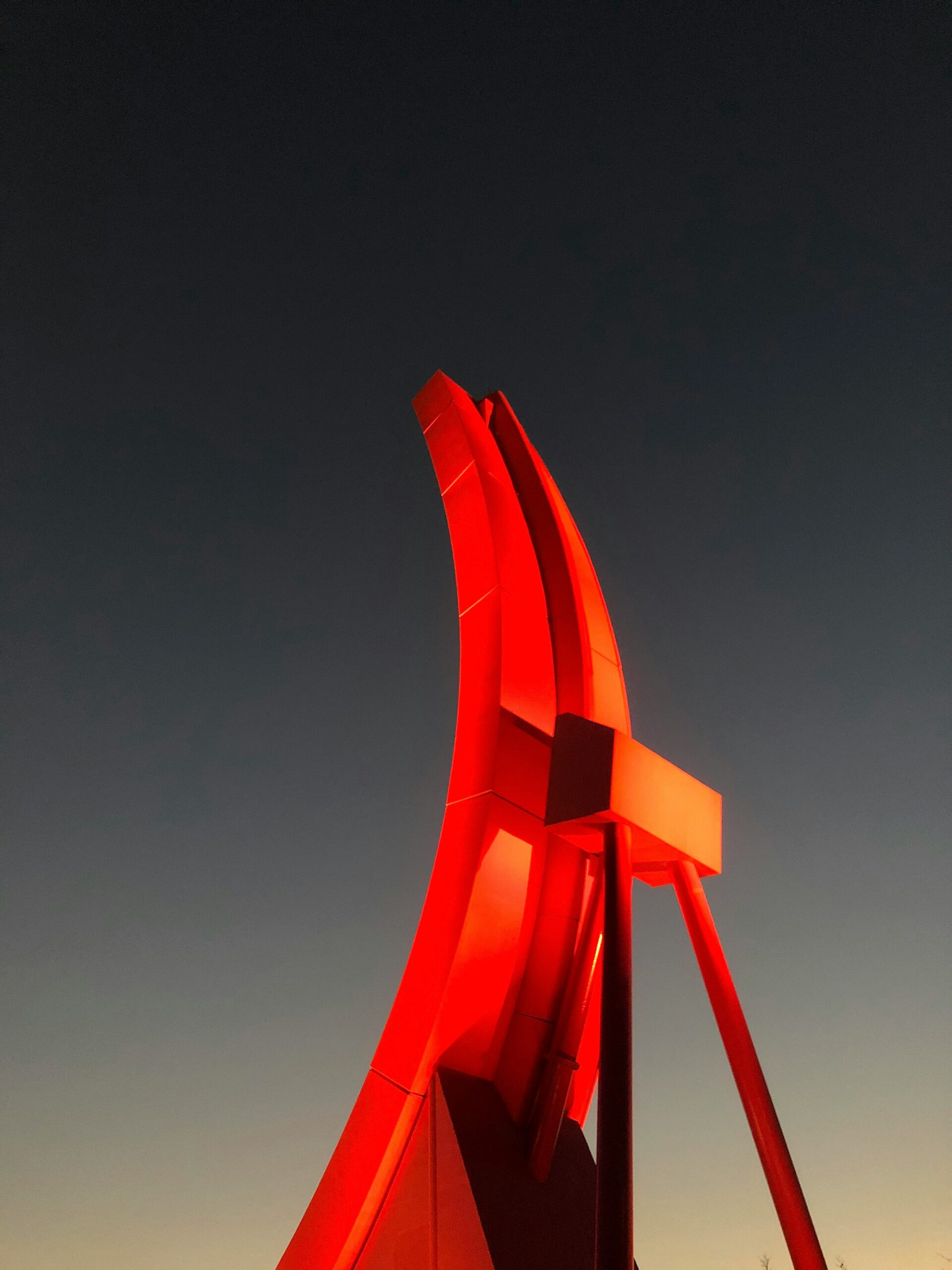 red metal frame under blue sky